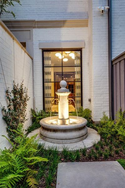 Captivating fountain outside the foyer/entry