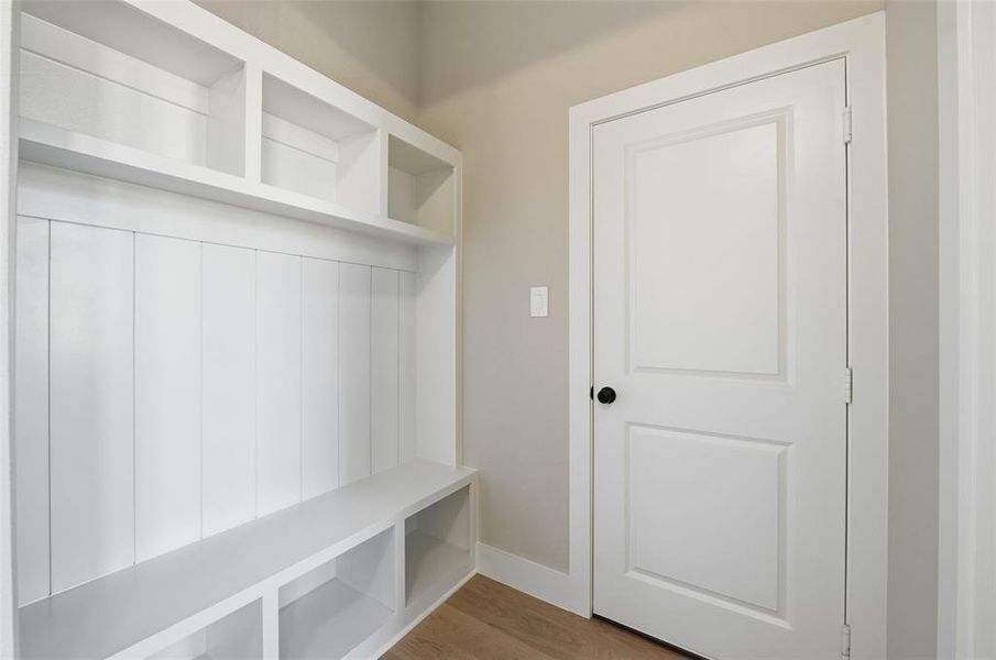 Mudroom with light wood-type flooring and baseboards Mudroom with light wood-type flooring and baseboards
