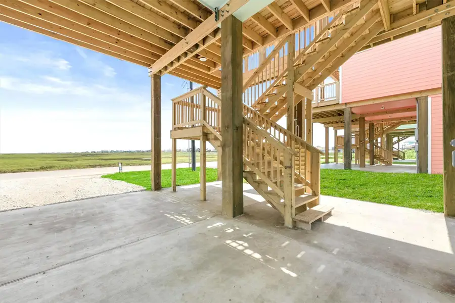Covered stairway with enclosed outdoor shower for easy, sand-free entry after the beach. Covered stairway with enclosed outdoor shower for easy, sand-free entry after the beach.