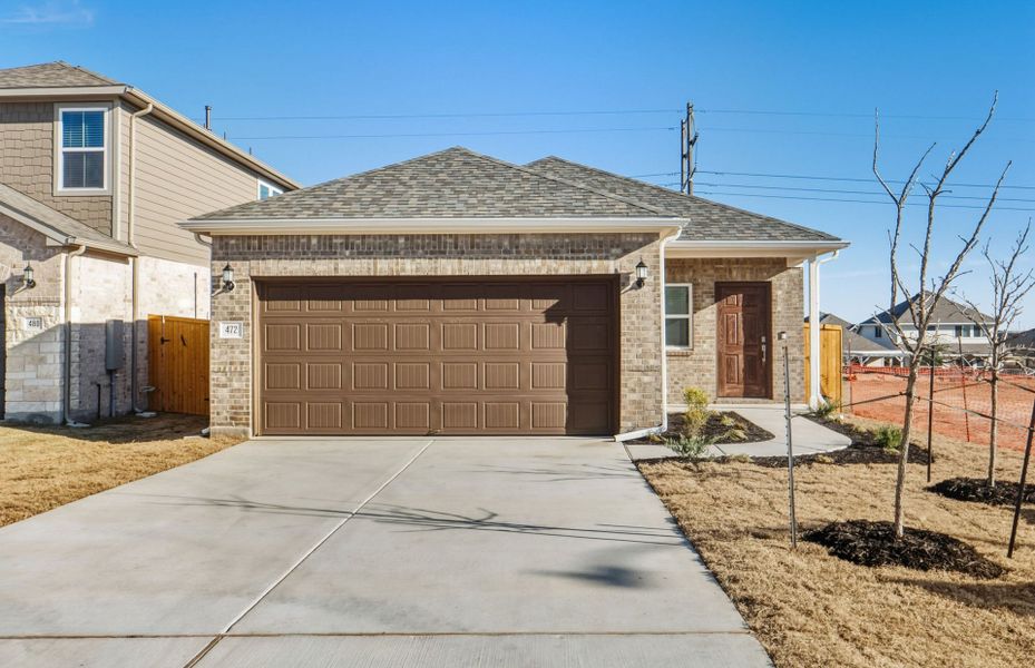 Front exterior of a new home in Crosswinds, Kyle, TX, highlighting curb appeal (Image 19).