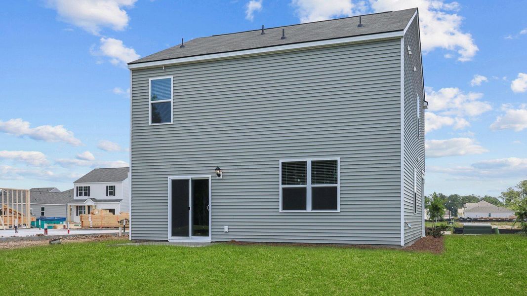 Exterior details and patio area of a home in Pine Hills at Cane Bay, Summerville (Image 3).