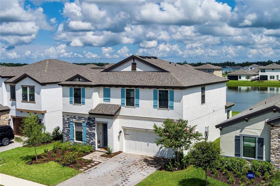 Front exterior of a new home in Crosswind Point, Parrish, FL, highlighting curb appeal (Image 2).