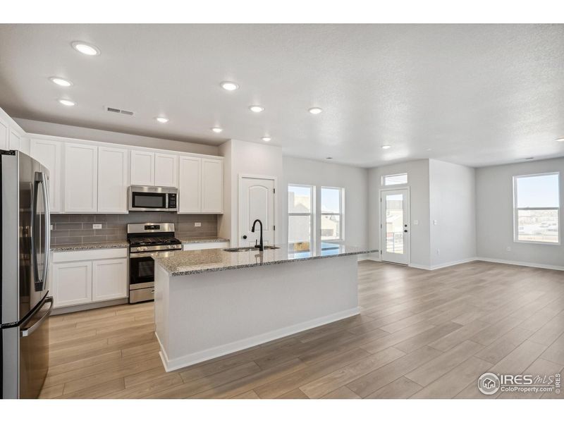 Furnished interior view inside a new home in Kinston Mainstreet Townhomes, Loveland (Image 7).