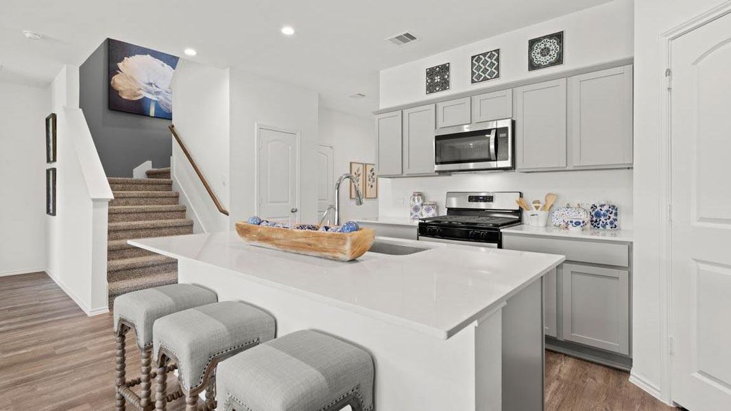 Furnished interior view inside a new home in Harrington Trails at The Canopies, New Caney (Image 9).