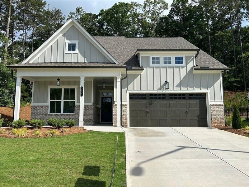 Front exterior of a new home in Cooks Farm, Woodstock, GA, highlighting curb appeal (Image 2).
