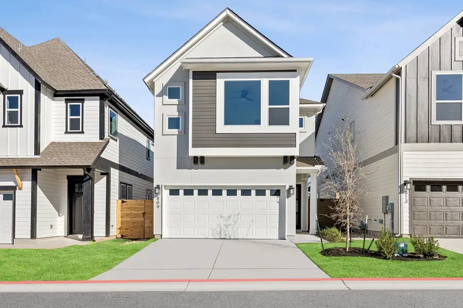 Front exterior of a new home in Double Creek Crossing, Round Rock, TX, highlighting curb appeal (Image 1). Front exterior of a new home in Double Creek Crossing, Round Rock, TX, highlighting curb appeal (Image 1).