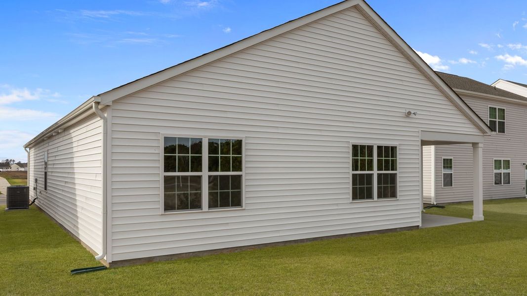 Exterior details and patio area of a home in Ridgewood Farms, Winterville (Image 20).