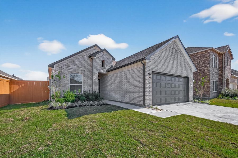 Front exterior of a new home in Lago Mar, Texas City, TX, highlighting curb appeal (Image 1). Front exterior of a new home in Lago Mar, Texas City, TX, highlighting curb appeal (Image 1).
