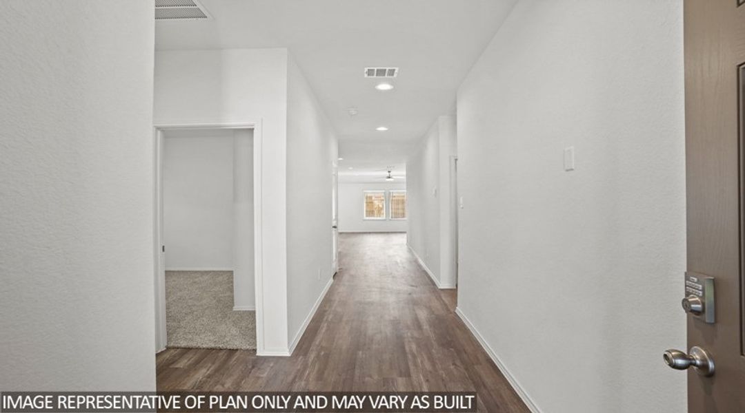 Representative unfurnished interior of a home built from the Texas Cali by D.R. Horton in Sunterra, Katy (Image 9).