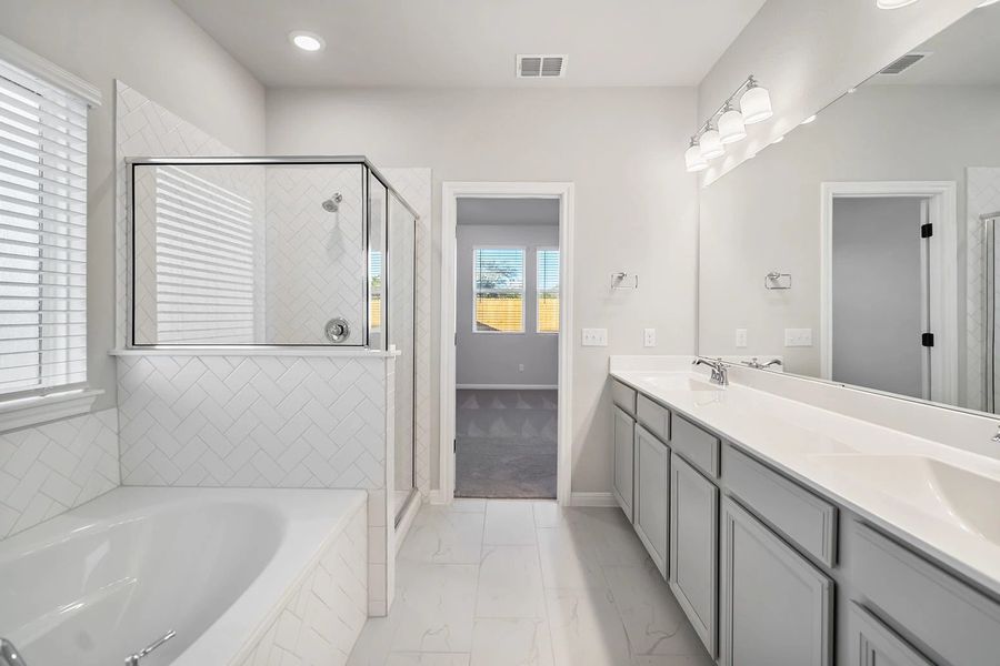 Representative furnished interior of a home built from the Granbury by Ashton Woods in The Trails at Carmel, Pflugerville (Image 31).
