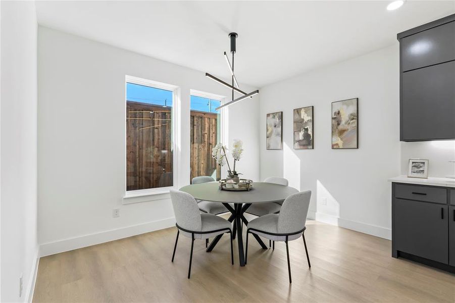 Dining space with light wood-type flooring