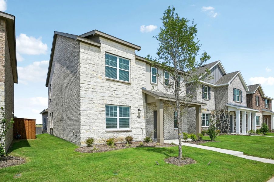 Representative exterior photo of a completed home built from the Eris by Starlight Homes in Brookshire at Legacy Hills, Celina, TX (Image 23).