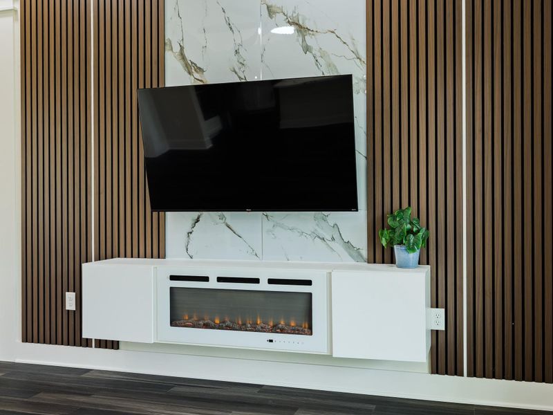 Entertainment center with built in electric fireplace.