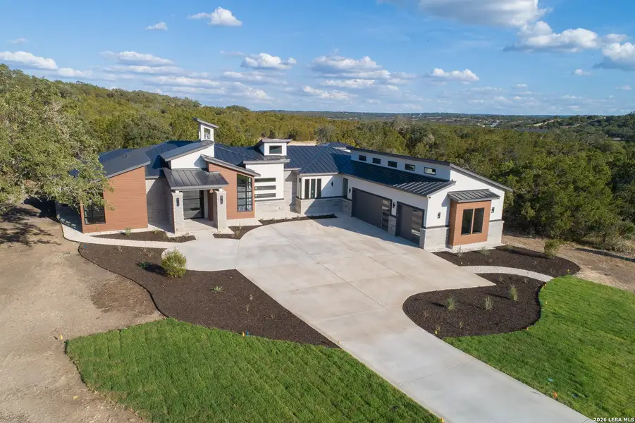Front exterior of a new home in , Canyon Lake, TX, highlighting curb appeal (Image 26). Front exterior of a new home in , Canyon Lake, TX, highlighting curb appeal (Image 26).