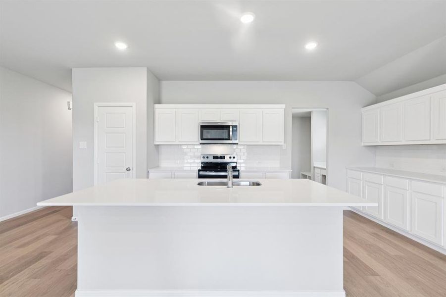 Kitchen in the Harrison home plan by Trophy Signature Homes – REPRESENTATIVE PHOTO Kitchen in the Harrison home plan by Trophy Signature Homes – REPRESENTATIVE PHOTO