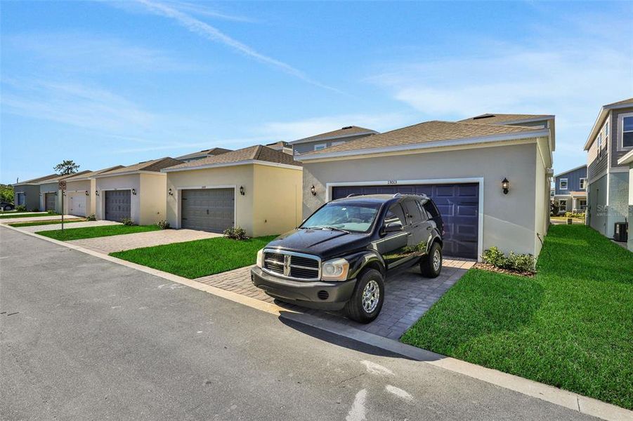 Exterior details and patio area of a home in Serenade at Ovation, Winter Garden (Image 25).