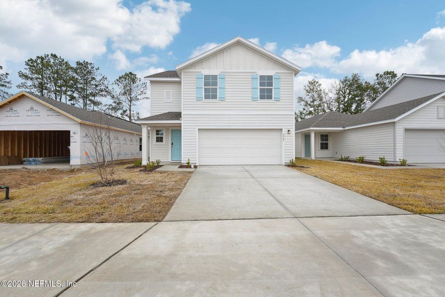 Front exterior of a new home in Kings Landing, Jacksonville, FL, highlighting curb appeal (Image 2). Front exterior of a new home in Kings Landing, Jacksonville, FL, highlighting curb appeal (Image 2).