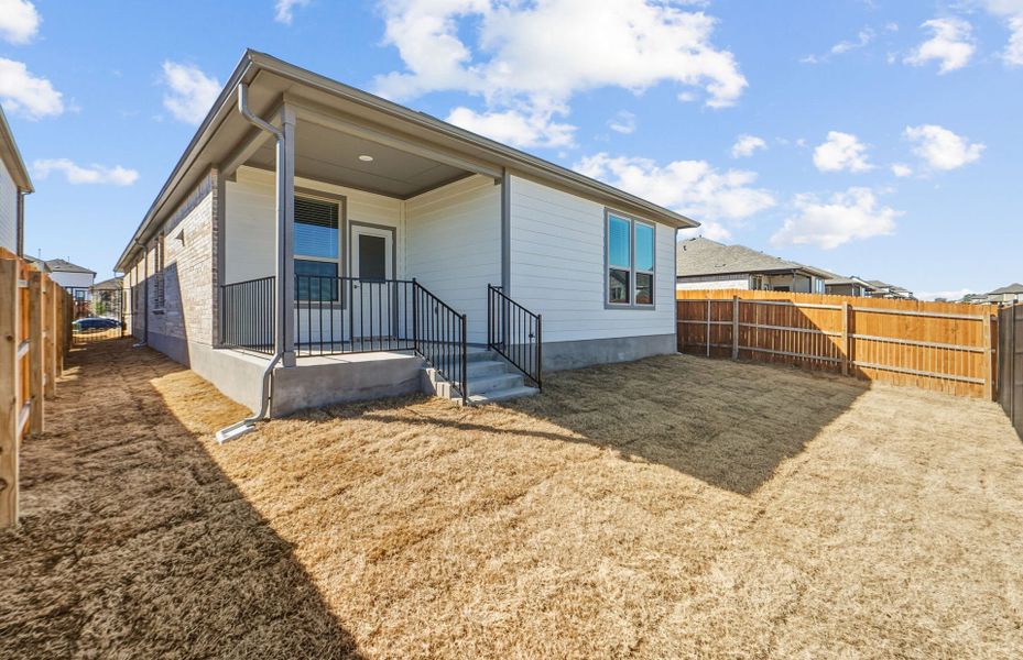 Exterior details and patio area of a home in Saddleback at Santa Rita Ranch, Liberty Hill (Image 28).