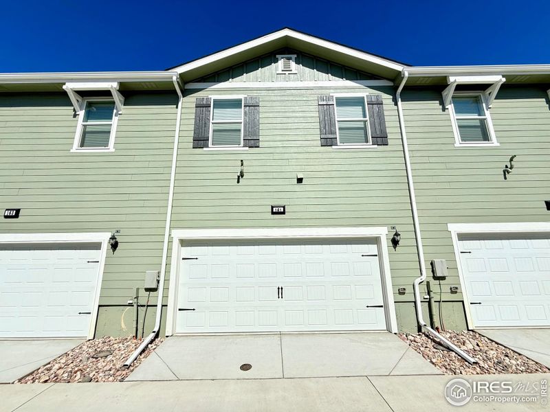Front exterior of a new home in Johnstown Village, Johnstown, CO, highlighting curb appeal (Image 14). Front exterior of a new home in Johnstown Village, Johnstown, CO, highlighting curb appeal (Image 14).
