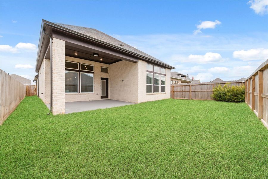 Exterior details and patio area of a home in Harvest Green - Reserve Collection, Richmond (Image 4).