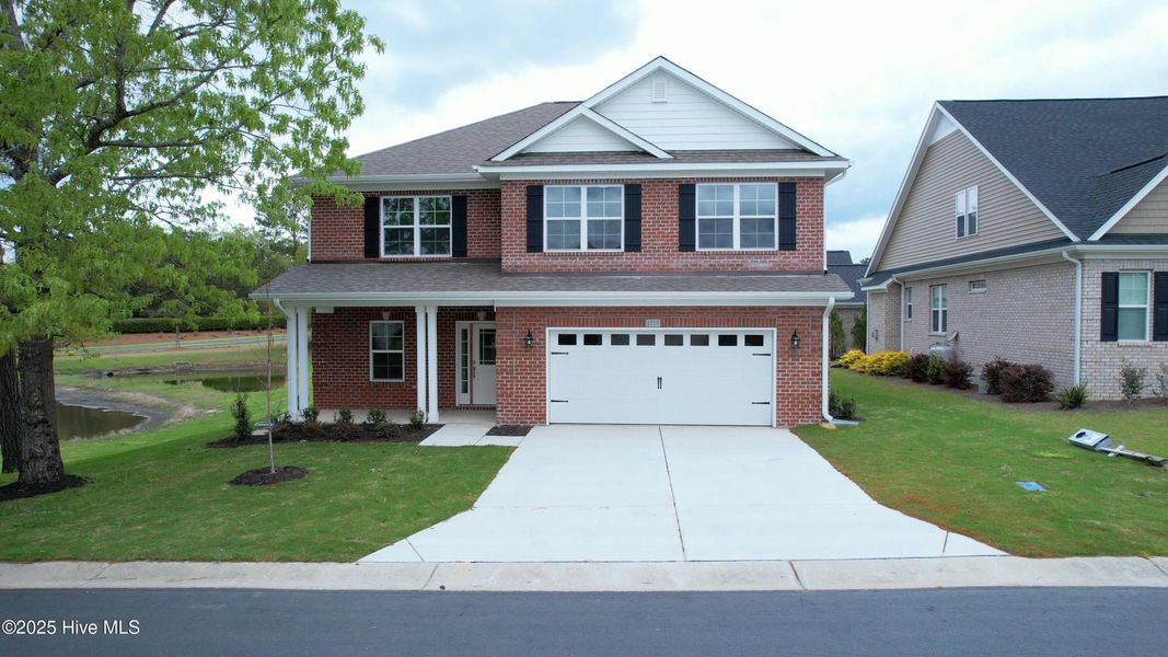 Front exterior of a new home in Palmetto Creek, Bolivia, NC, highlighting curb appeal (Image 2).