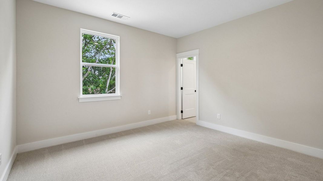 Bedroom with carpet and window Bedroom with carpet and window