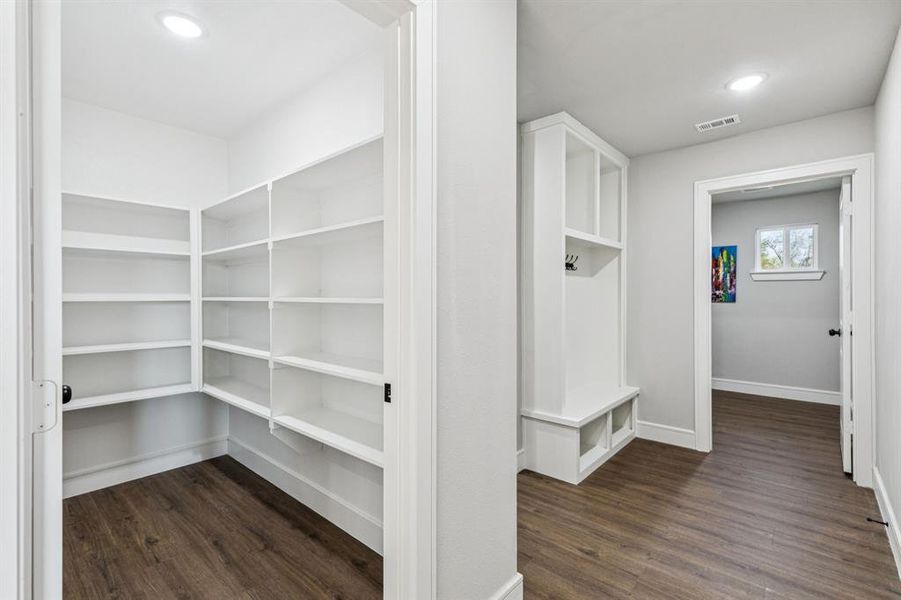 Mudroom featuring dark wood-type flooring and recessed lighting