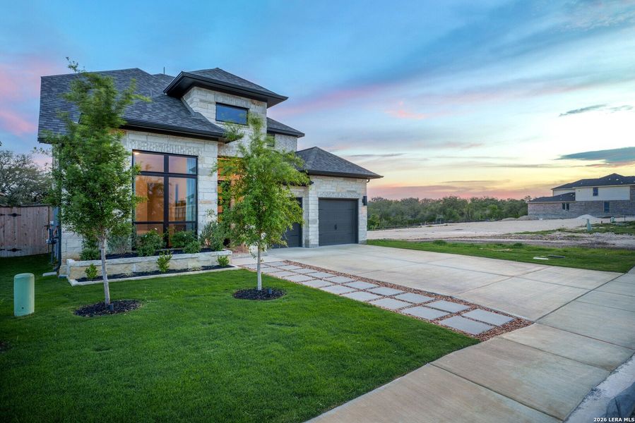 Front exterior of a new home in Ladera, San Antonio, TX, highlighting curb appeal (Image 25). Front exterior of a new home in Ladera, San Antonio, TX, highlighting curb appeal (Image 25).