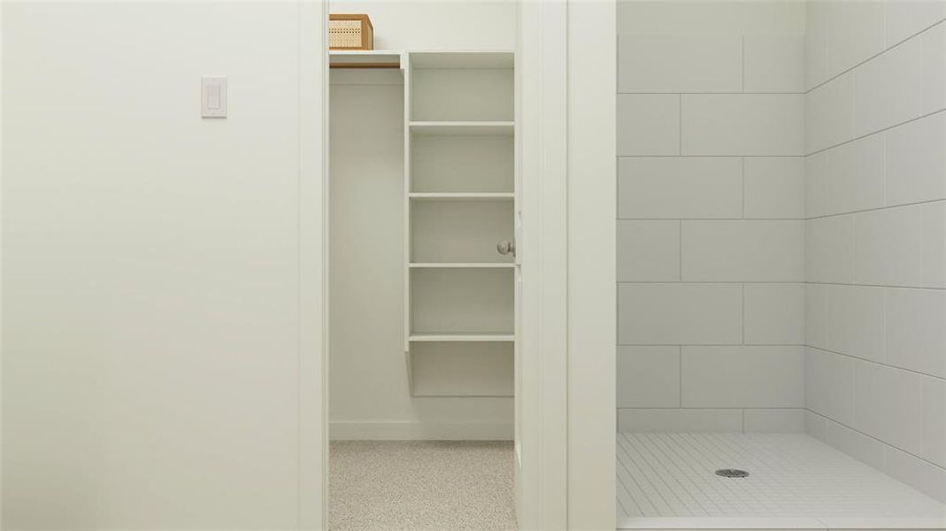 Bathroom featuring a tile shower