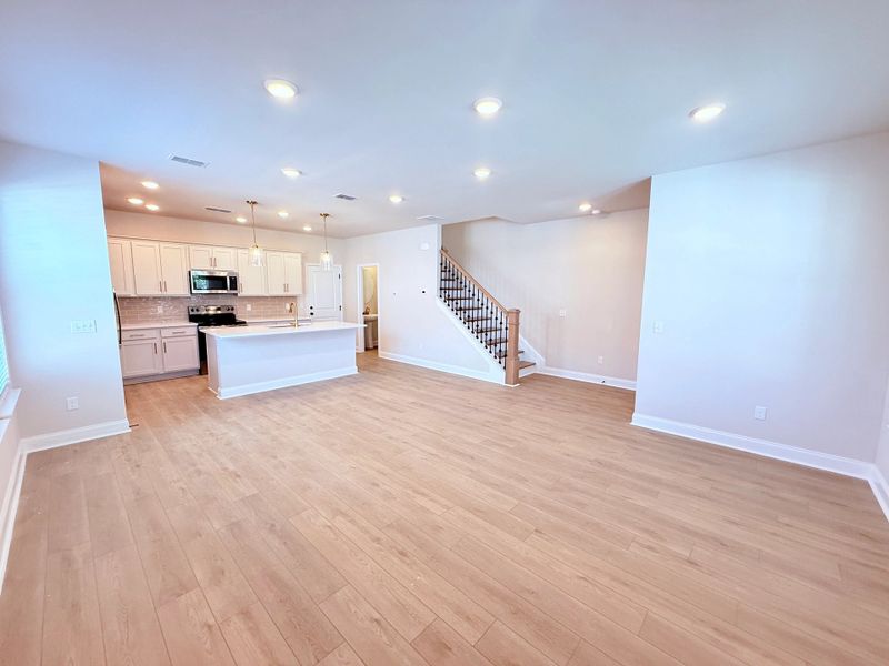 Living Area and Hardwood Stairs
