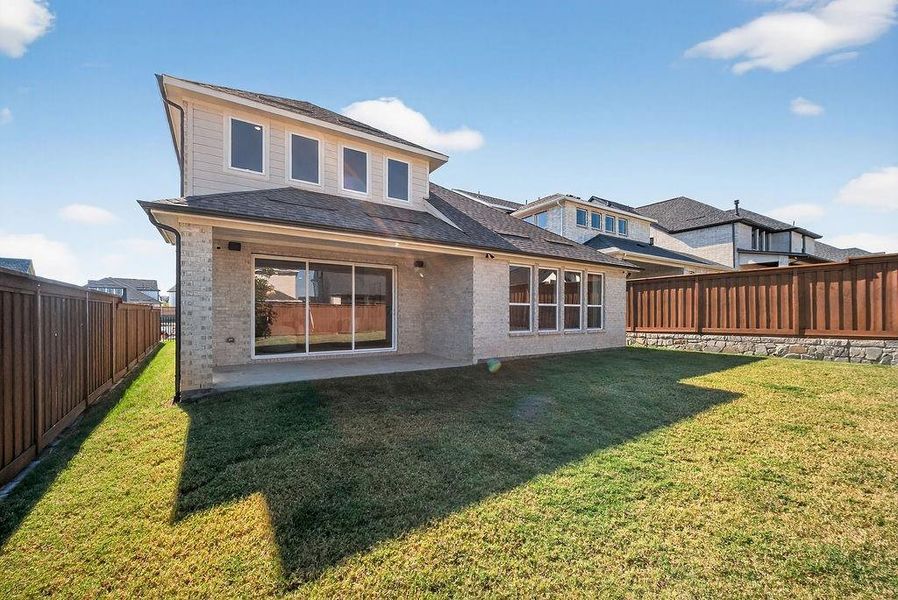 Back of house featuring brick siding, a patio, a fenced backyard, and a shingled roof Back of house featuring brick siding, a patio, a fenced backyard, and a shingled roof