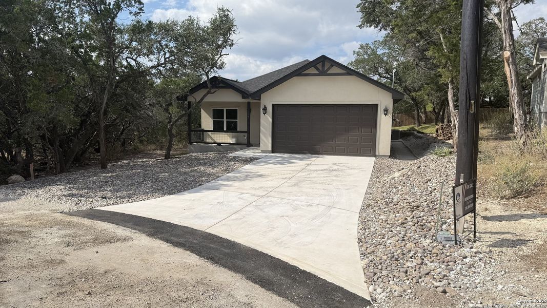 Front exterior of a new home in , Spring Branch, TX, highlighting curb appeal (Image 2). Front exterior of a new home in , Spring Branch, TX, highlighting curb appeal (Image 2).