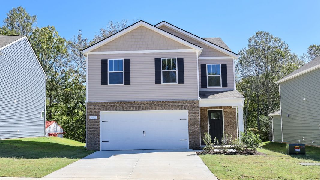 Front exterior of a new home in Paddington Place, Baxter, TN, highlighting curb appeal (Image 1). Front exterior of a new home in Paddington Place, Baxter, TN, highlighting curb appeal (Image 1).