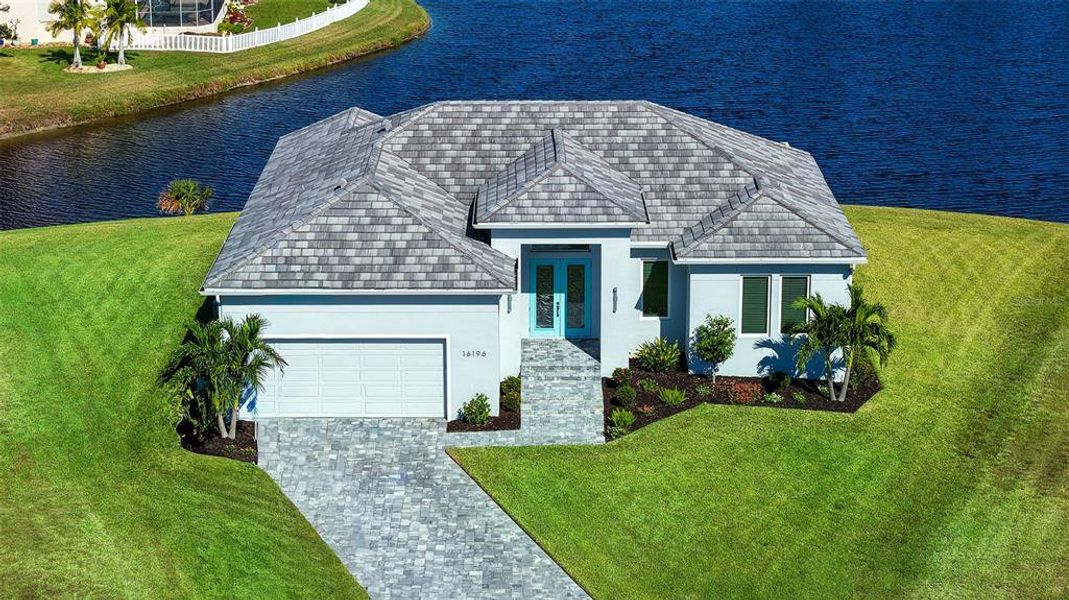 Front exterior of a new home in , Punta Gorda, FL, highlighting curb appeal (Image 1). Front exterior of a new home in , Punta Gorda, FL, highlighting curb appeal (Image 1).