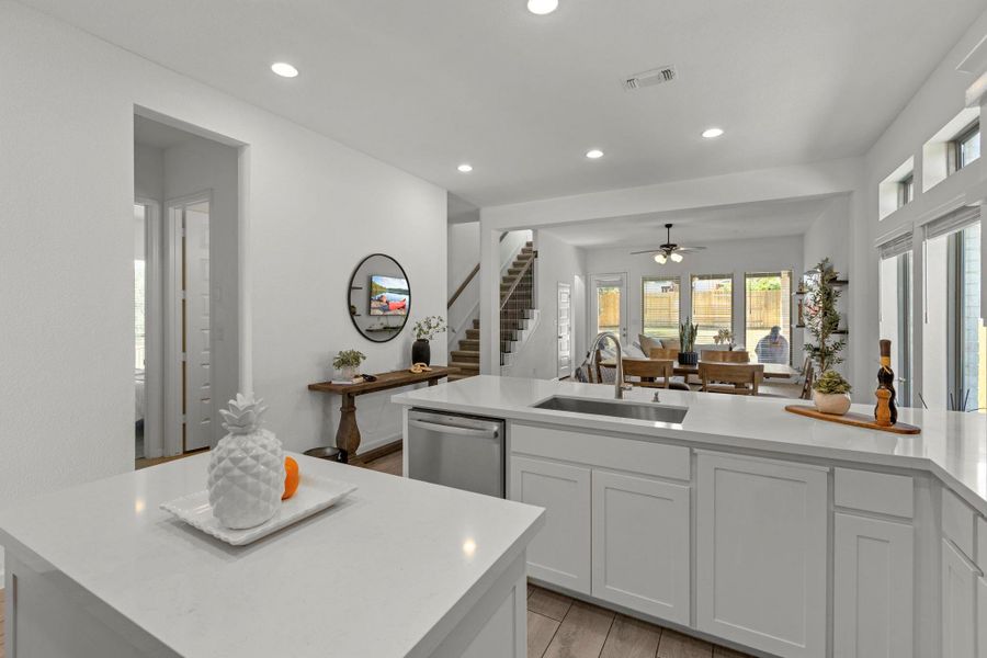 Clean lines and a spacious open floor plan define this modern culinary space.
