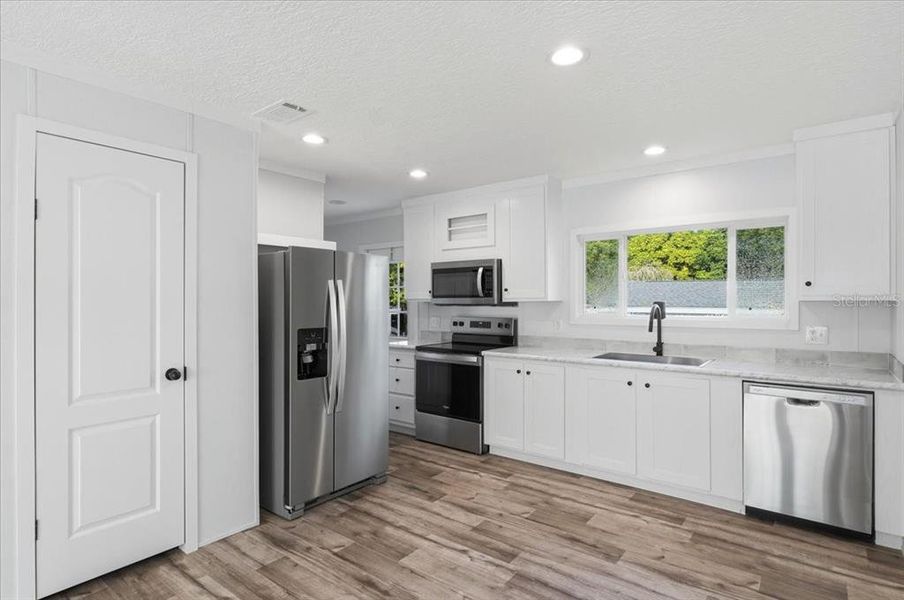 Furnished interior view inside a new home in , Port Richey (Image 4).