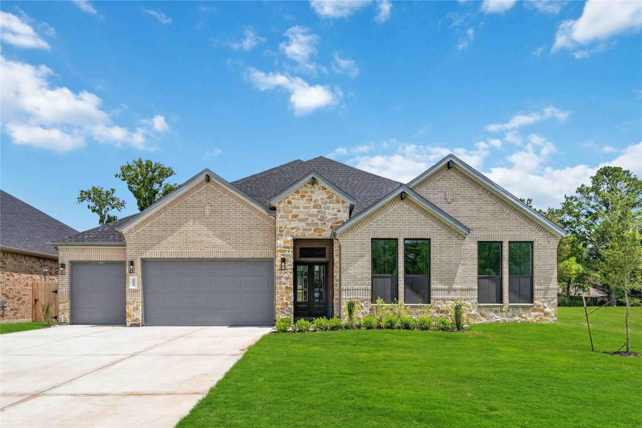 Front exterior of a new home in Friendswood Trails 70' Homesites, Friendswood, TX, highlighting curb appeal (Image 20).