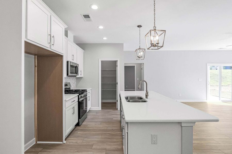 Representative furnished interior of a home built from the Weymouth by Caviness & Cates Communities in Bartlett Manor, Youngsville (Image 119).