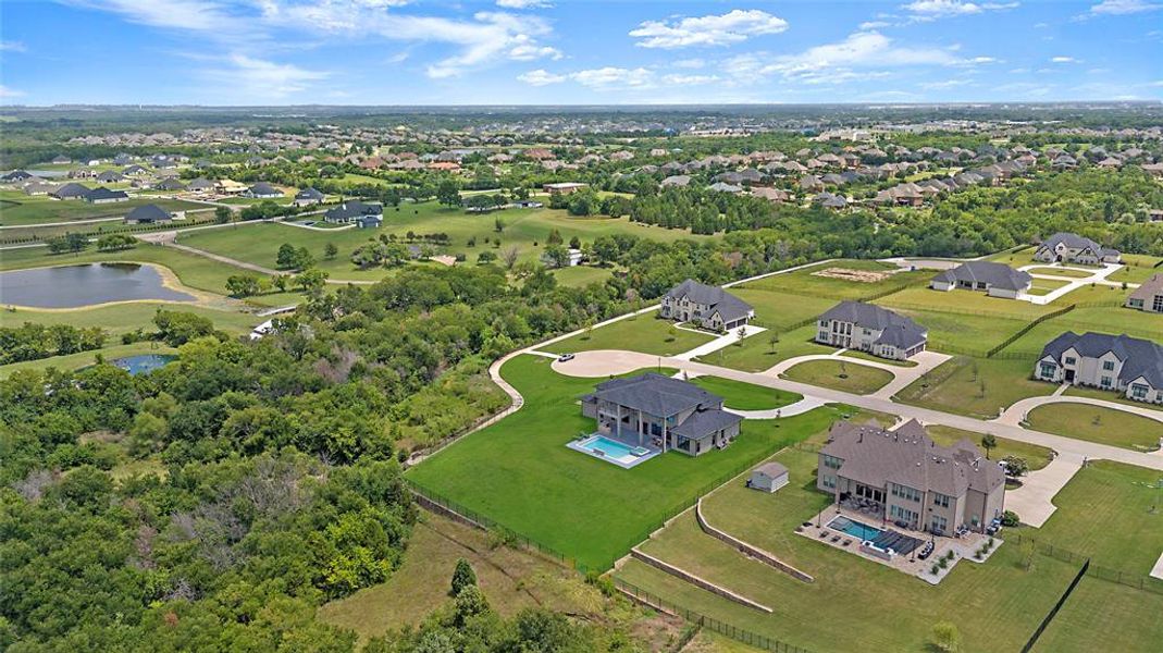 Aerial perspective of suburban area with a large body of water
