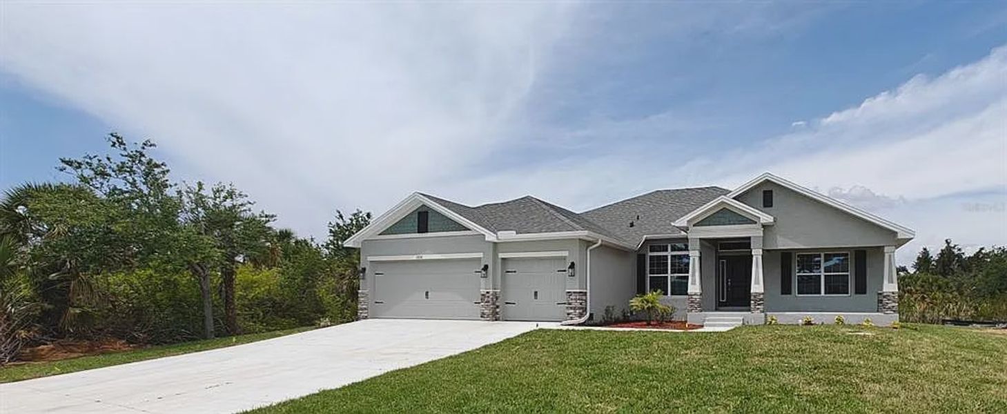 Front exterior of a new home in South Gulf Cove, Port Charlotte, FL, highlighting curb appeal (Image 1). Front exterior of a new home in South Gulf Cove, Port Charlotte, FL, highlighting curb appeal (Image 1).