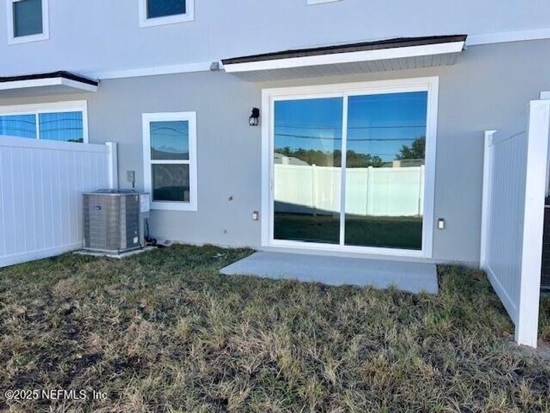 Exterior details and patio area of a home in The Landing, Middleburg (Image 3).