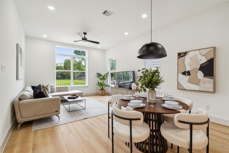 Soaring ceilings, picture windows, and seamless flow between living and dining spaces create an environment that feels spacious, connected, and full of light. Soaring ceilings, picture windows, and seamless flow between living and dining spaces create an environment that feels spacious, connected, and full of light.