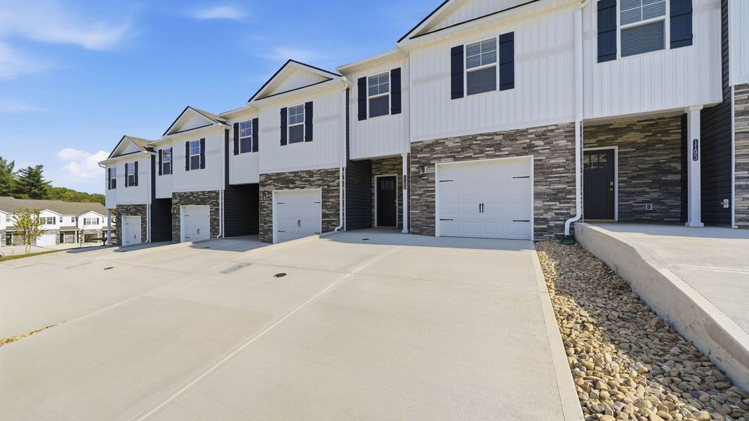 Front exterior of a new home in The Arbor Townhomes, Kingsport, TN, highlighting curb appeal (Image 15). Front exterior of a new home in The Arbor Townhomes, Kingsport, TN, highlighting curb appeal (Image 15).