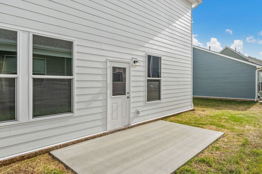 Front exterior of a new home in Sage Farms, White House, TN, highlighting curb appeal (Image 6).