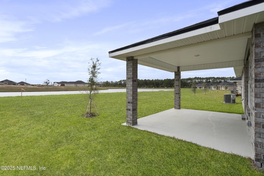 Exterior details and patio area of a home in Shadow Crest at Rolling Hills, Green Cove Springs (Image 18).