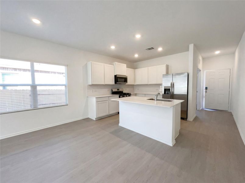 Furnished interior view inside a new home in The Colony, Bastrop (Image 11).