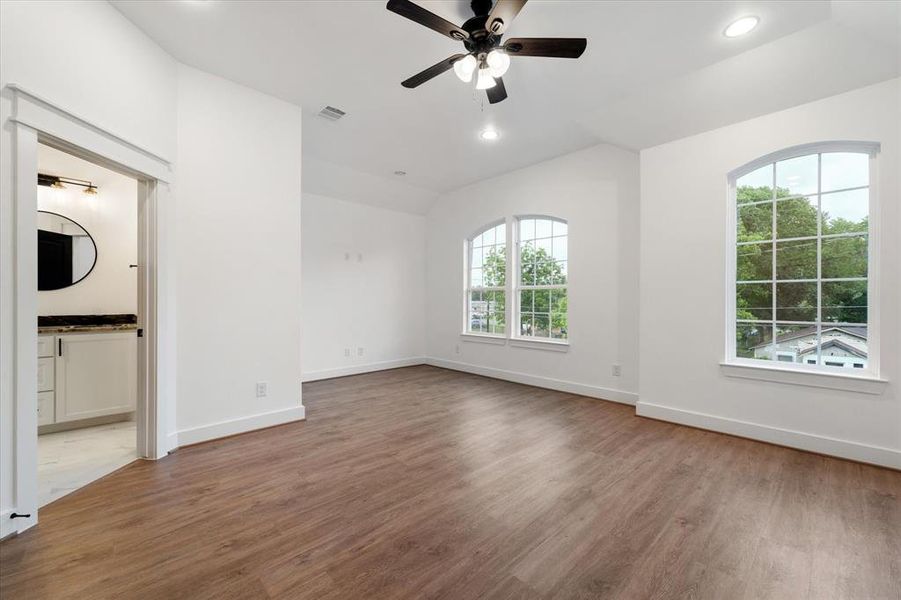 The primary bedroom! Offering luxury vinyl flooring, plenty of natural light from the forward facing windows and of course a dreamy en suite bathroom.