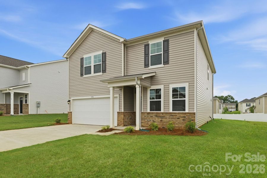 Front exterior of a new home in Carpenter Farms, Lincolnton, NC, highlighting curb appeal (Image 2). Front exterior of a new home in Carpenter Farms, Lincolnton, NC, highlighting curb appeal (Image 2).