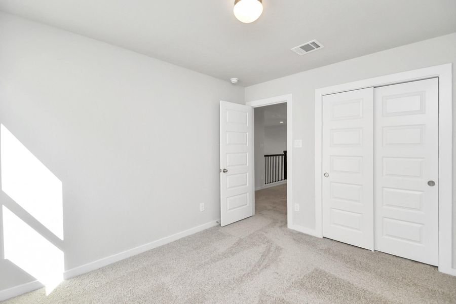 Generously sized secondary bedrooms, complete with spacious closets and soft,inviting carpeting. Enjoy abundant natural light streaming in through the largewindows, complemented by privacy blinds for your personal sanctuary. Sample photo of completed home with similar floor plan. Actual colors and selections may vary.