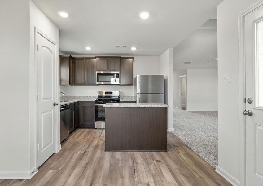 The kitchen of the Sabine has beautiful wood cabinets.